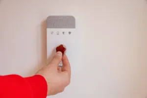 Verisure specialist testing an alarm system after installation