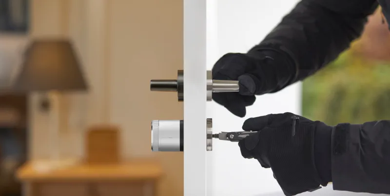 Burglar picking a lock