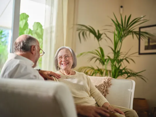 Smiling elderly couple at home