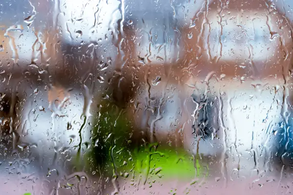 Rain water streaming down a window