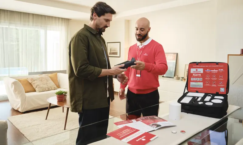 Verisure techician installing alarm